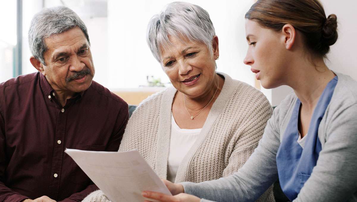 Elderly couple getting advice