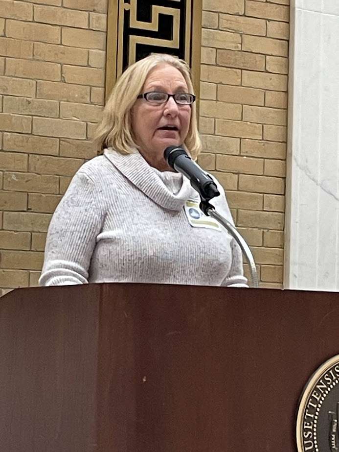 Marion Leblanc at the podium at the MA statehouse