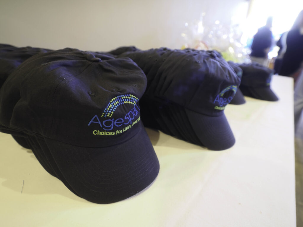 AgeSpan hats lined up on a table